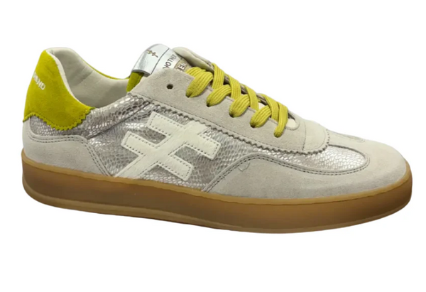 Sneaker with yellow accents on a white background